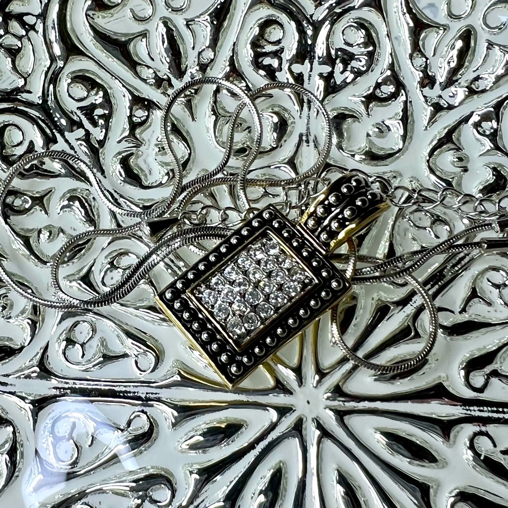 Silver and goldtone pendant